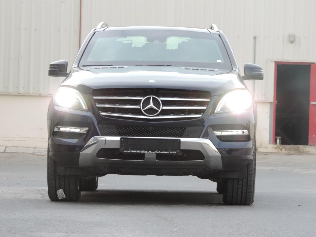 Mercedes-Benz ML 400 Blue front view with lights on