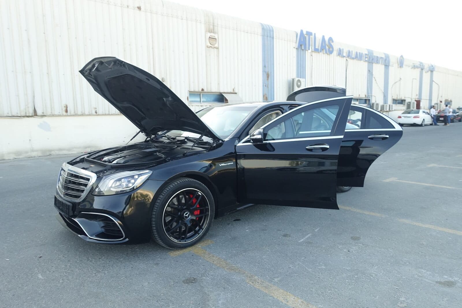 Mercedes S63 AMG armored luxury sedan front left view with doors open