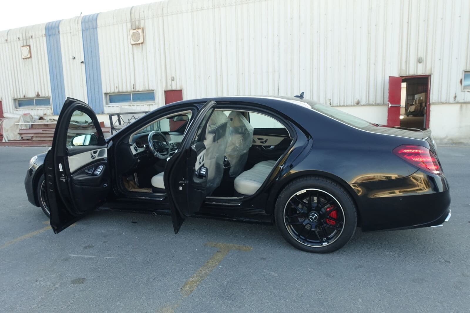 Mercedes S63 AMG armored luxury sedan left side with doors open