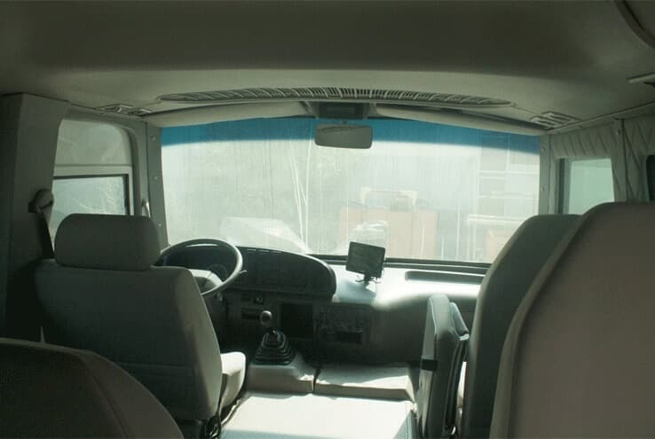 Toyota Coaster armored passenger carrier driver cockpit view