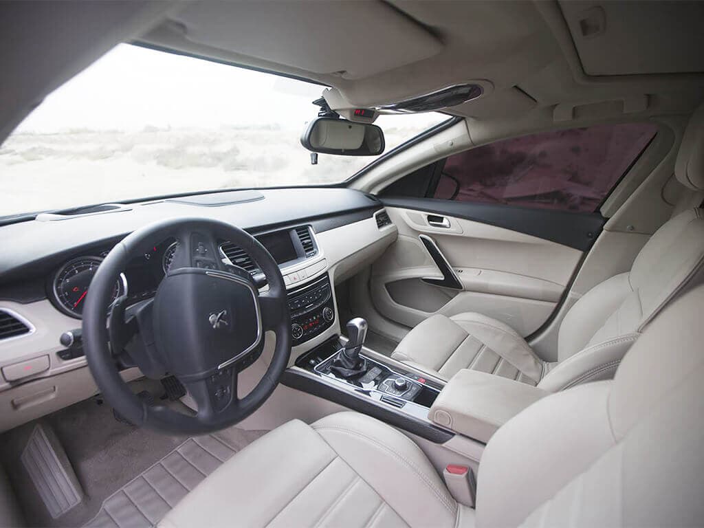 Peugeot 508 armored sedan cockpit view through tinted window