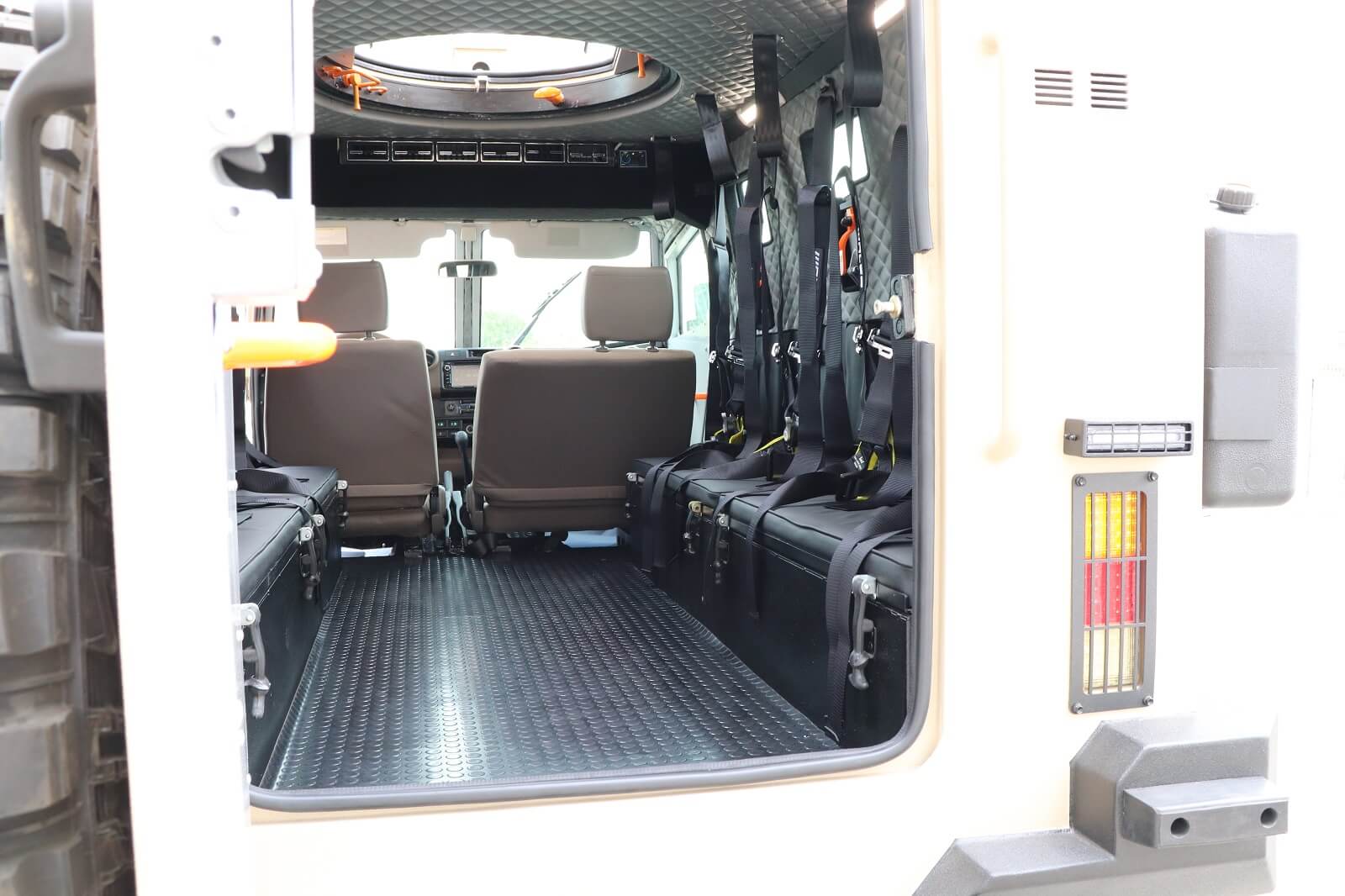APC 6x6 Tygra trunk open showing rear seating layout