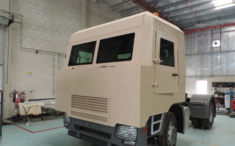 Armored Mercedes-Benz Actros cash transport front grille view