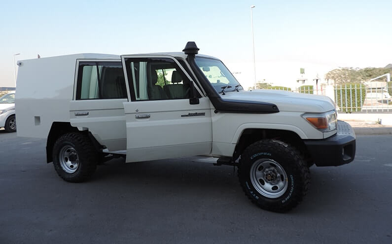 Armored Toyota Land Cruiser side door open cabin view