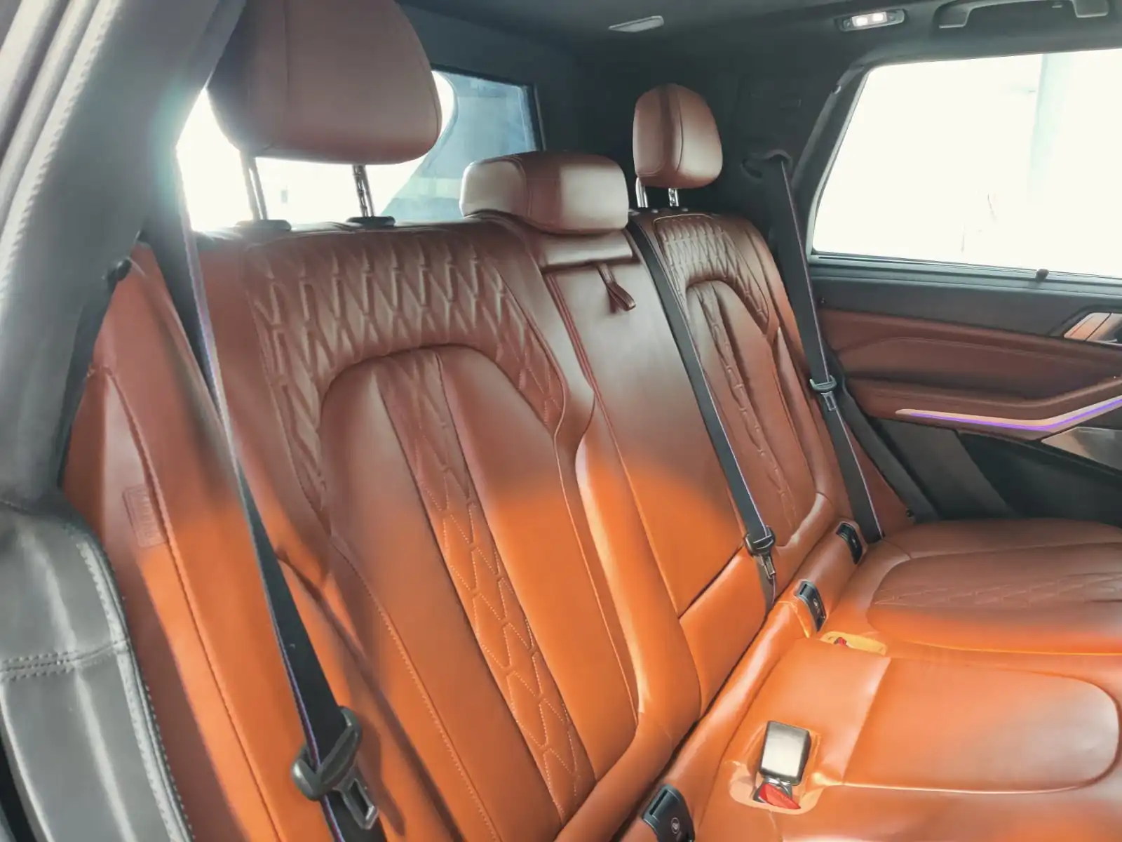 BMW X5 M50i grey armored luxury SUV rear passenger seats