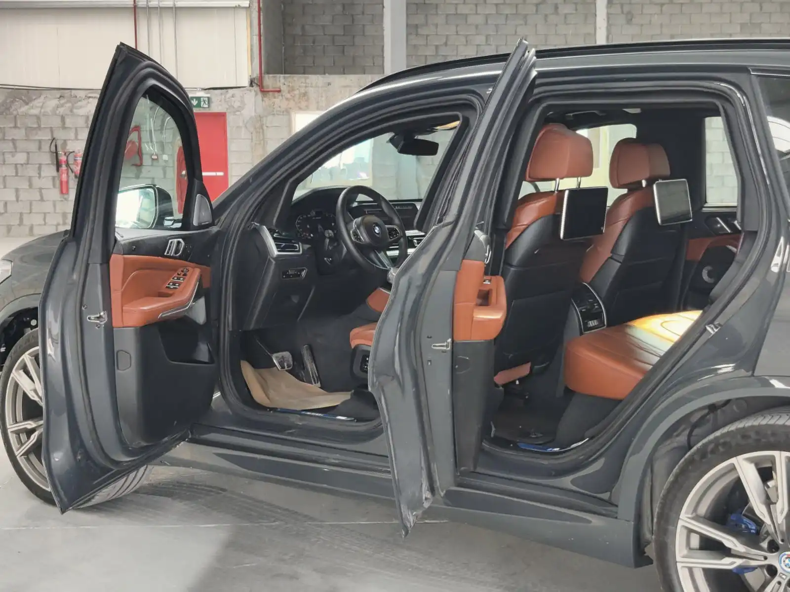 BMW X5 M50i grey armored luxury SUV left side doors open