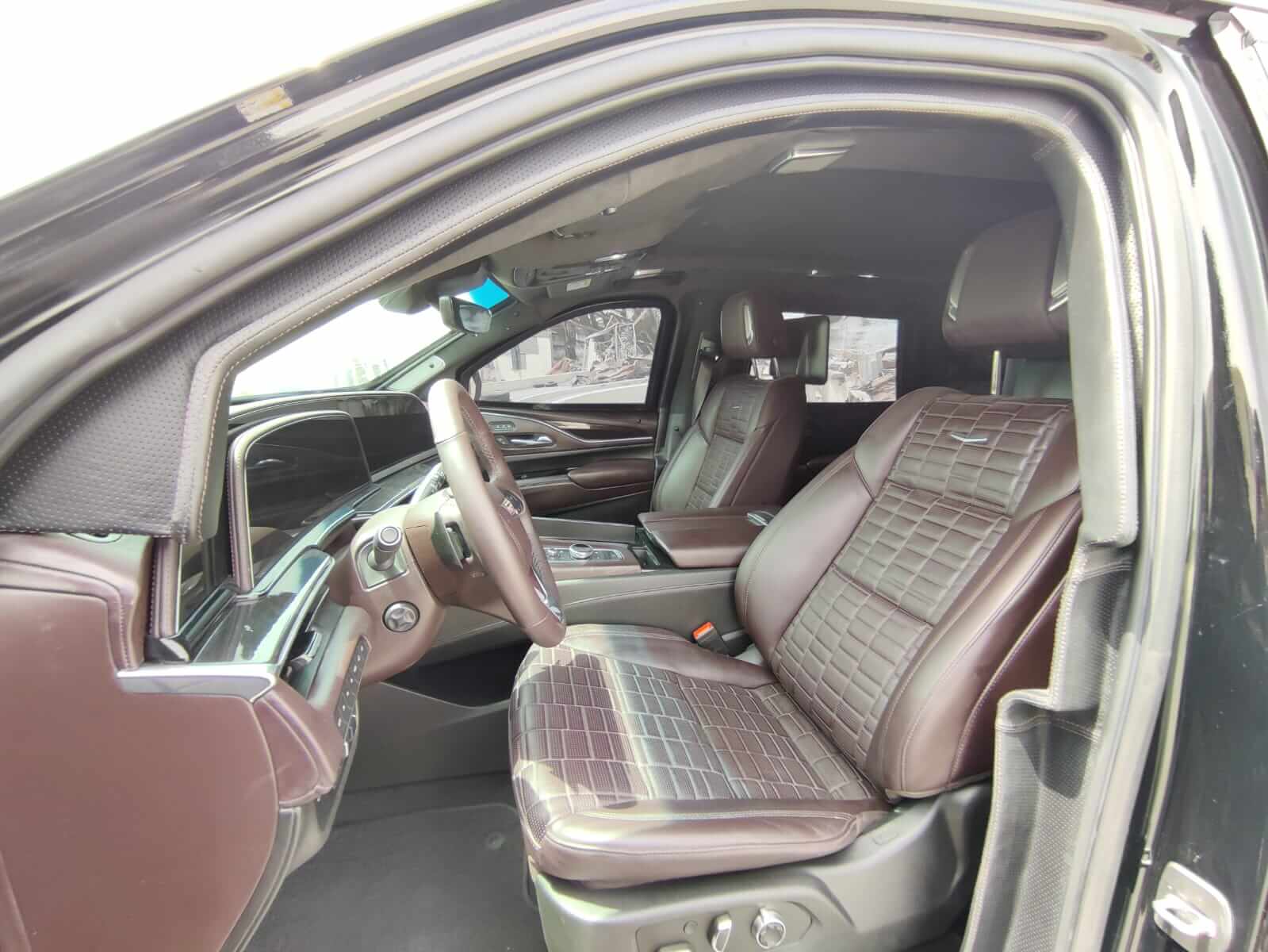Cadillac Escalade armored luxury SUV driver seat interior view