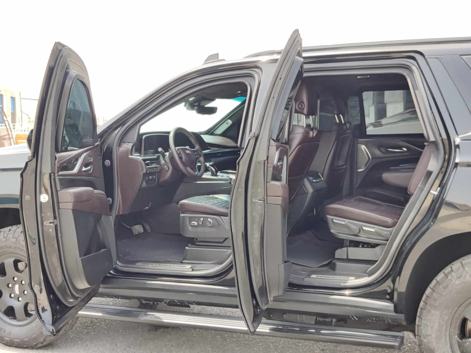 Cadillac Escalade armored luxury SUV right side doors open detail