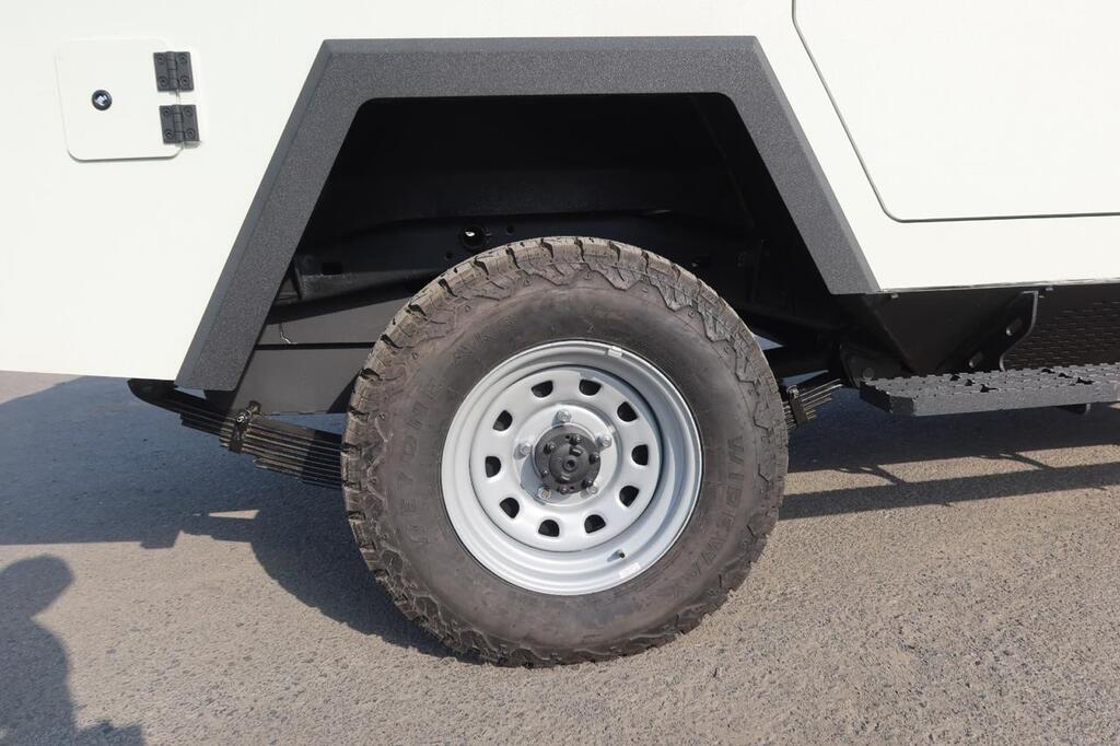 Close-up of all-terrain tire mounted on LC79 steel wheel