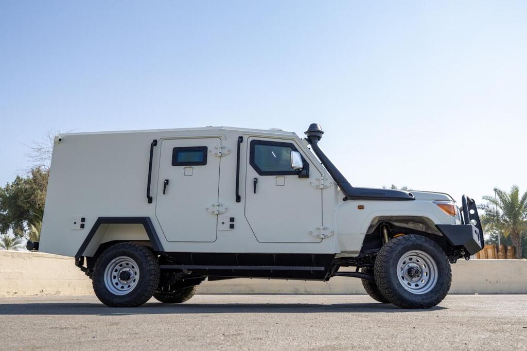 Full side view of Toyota LC79 Troop Carrier with heavy-duty off-road suspension