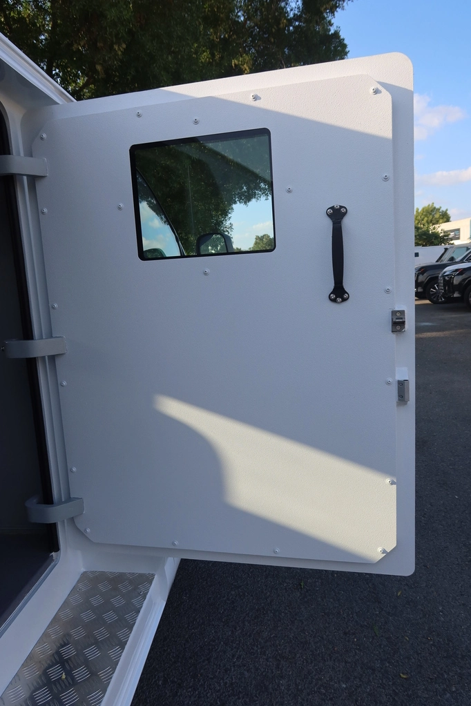 GMC SAVANA 6.7L - WHITE (CIT) - armored door open