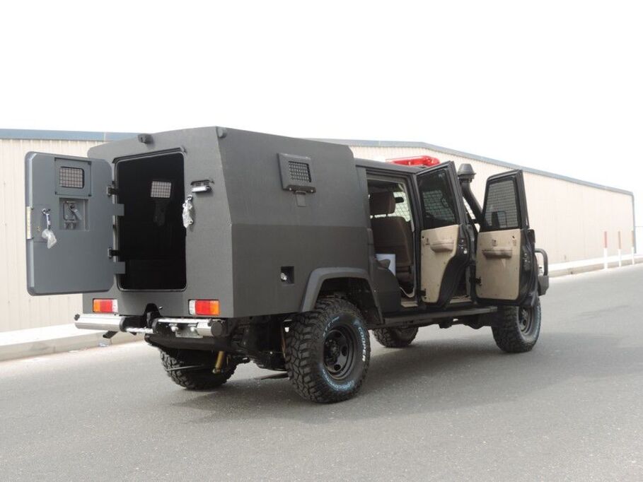 LC79 Double Cab with armored security module and open rear access door