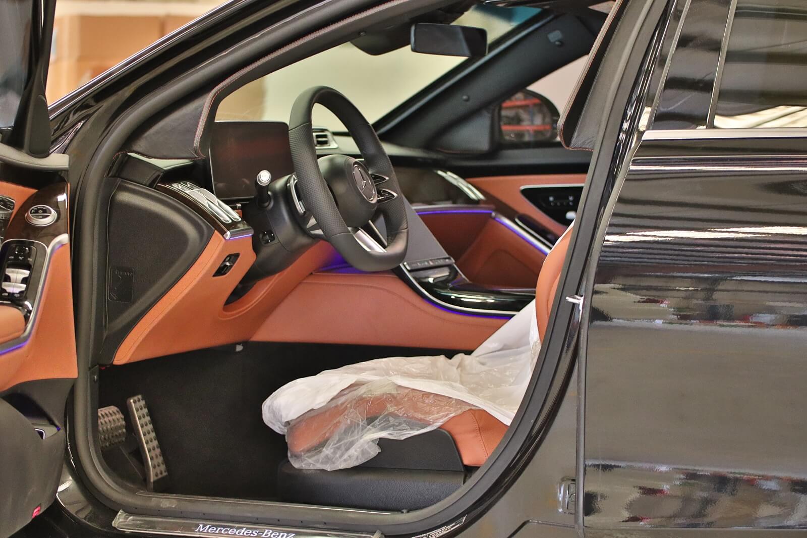 Mercedes-Benz S500 armored luxury sedan driver seat with door open
