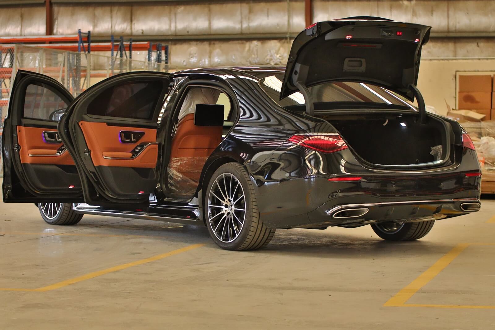 Mercedes-Benz S500 armored luxury sedan left side with doors and trunk open