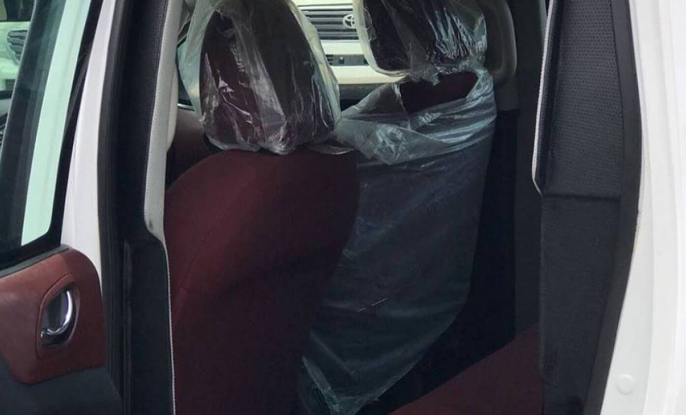 Nissan Navara armored pickup passenger door open with seats visible