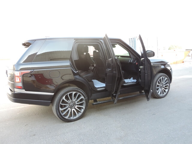 Range Rover Vogue armored luxury SUV right side with doors open