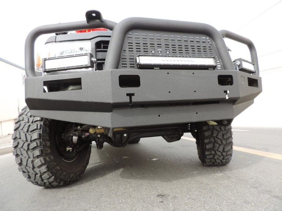 Reinforced front suspension system with heavy-duty shocks on LC79