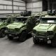 SchutzCarr TYGOR MRAP military-grade armored tactical vehicles in olive green with roof-mounted surveillance systems and reinforced chassis