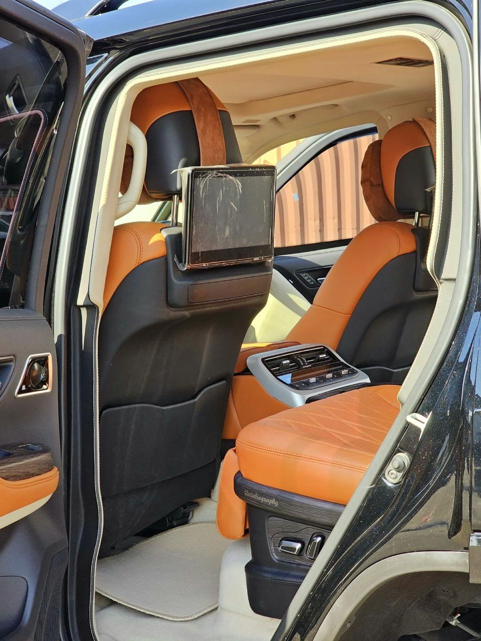 Toyota Land Cruiser 300 VXR luxury interior with tan leather seats and rear entertainment screens