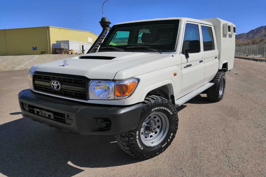 Toyota Land Cruiser 70 Series armored cash-in-transit vehicle with custom security box bod