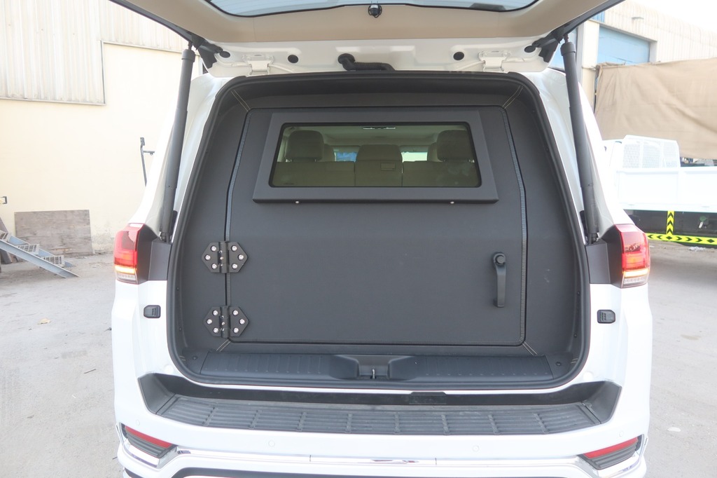 Toyota Land Cruiser ZX cargo area with custom security panel and viewing window