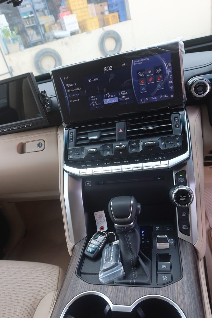 Toyota Land Cruiser ZX center console with touchscreen, drive selector and wood trim