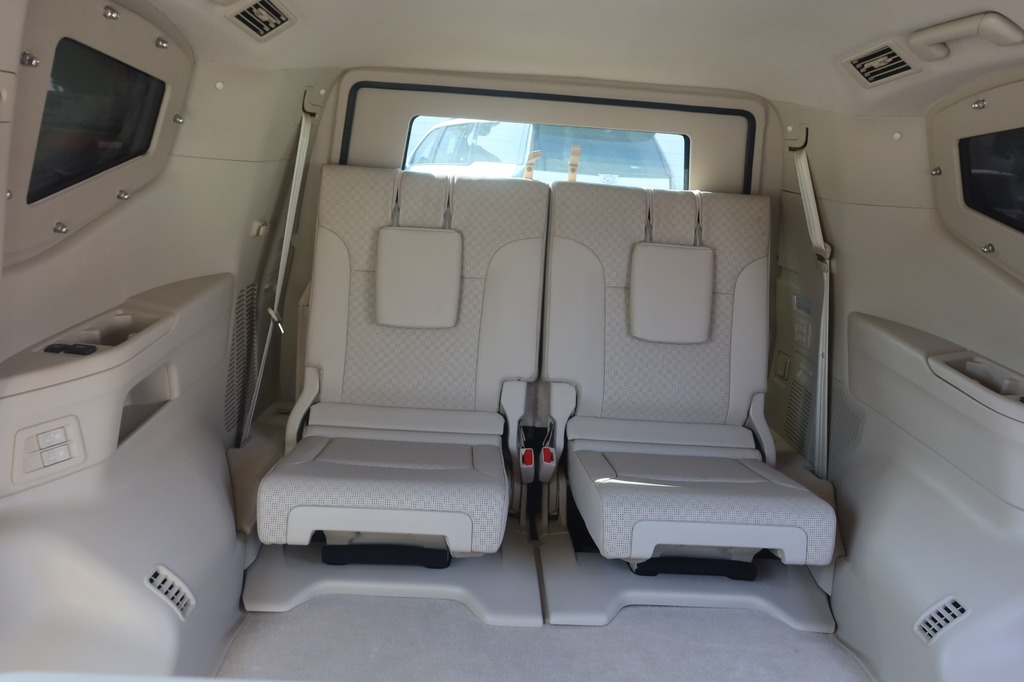 Toyota Land Cruiser ZX second-row captain seats with center console and climate vents