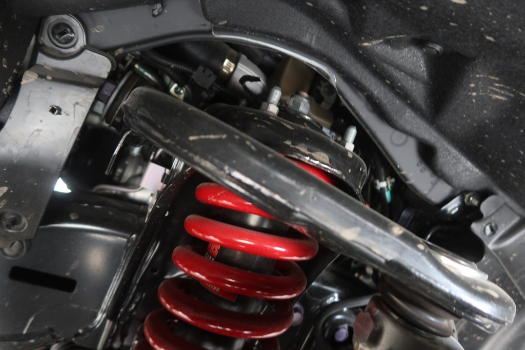 Toyota Land Cruiser ZX upgraded suspension with red coil springs and shock absorber