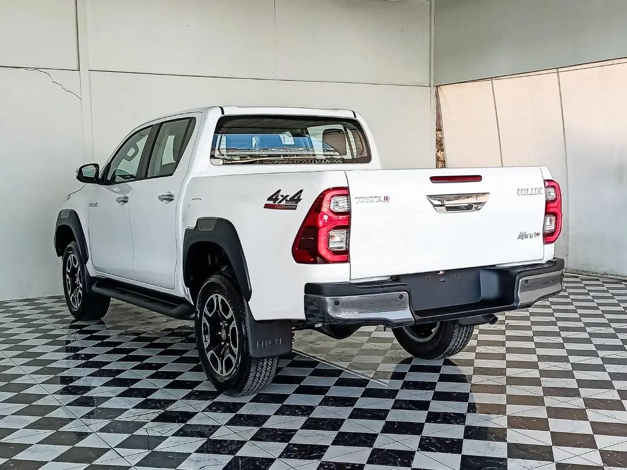 Toyota RHD Hilux 2.8L DC armored pickup rear left exterior view