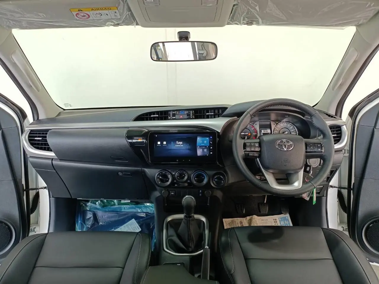 Toyota RHD Hilux 2.8L DC armored pickup cockpit interior view