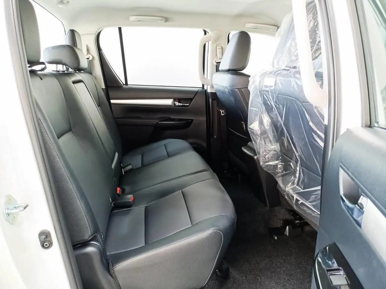 Toyota RHD Hilux 2.8L DC armored pickup rear seat interior view
