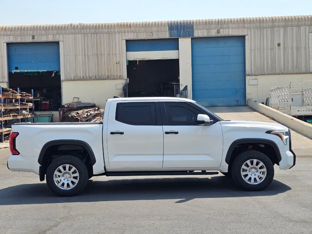 White 2027 Toyota Tundra BR7 armored pickup in full right-side profile