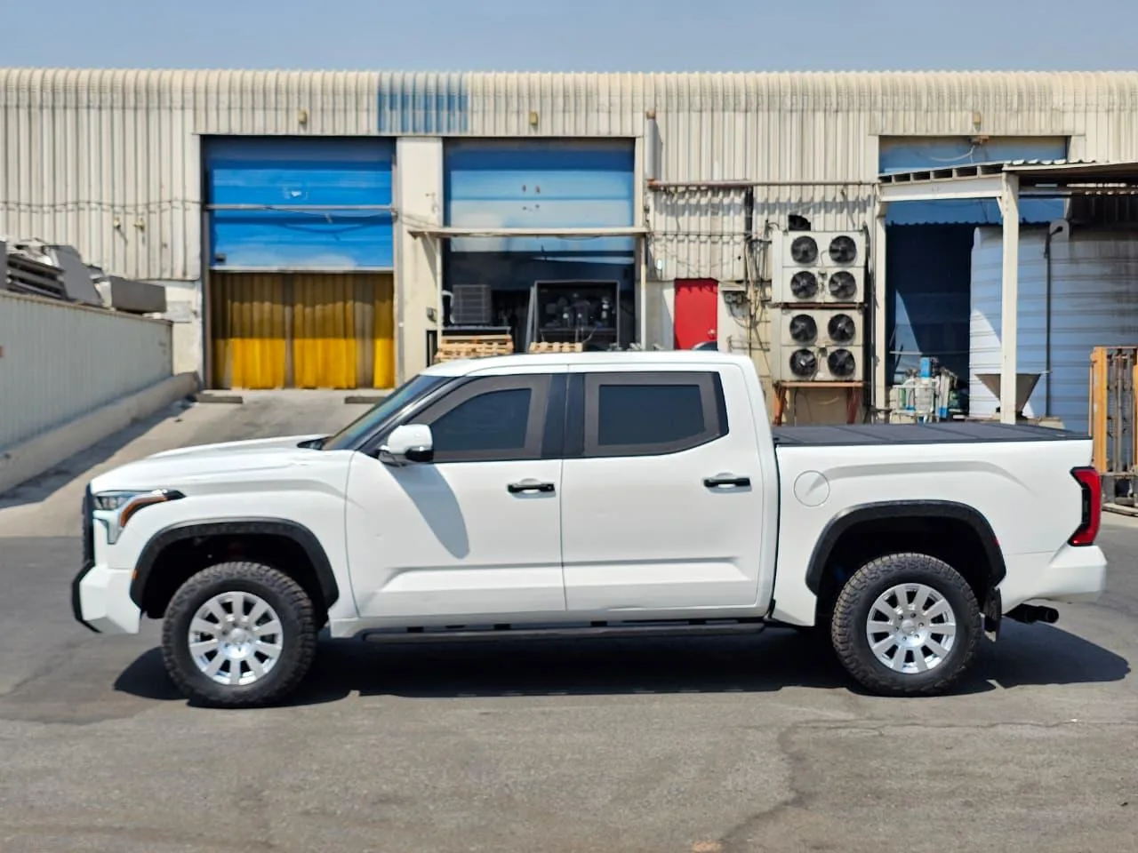 White 2027 Toyota Tundra BR7 armored pickup in full left-side profile
