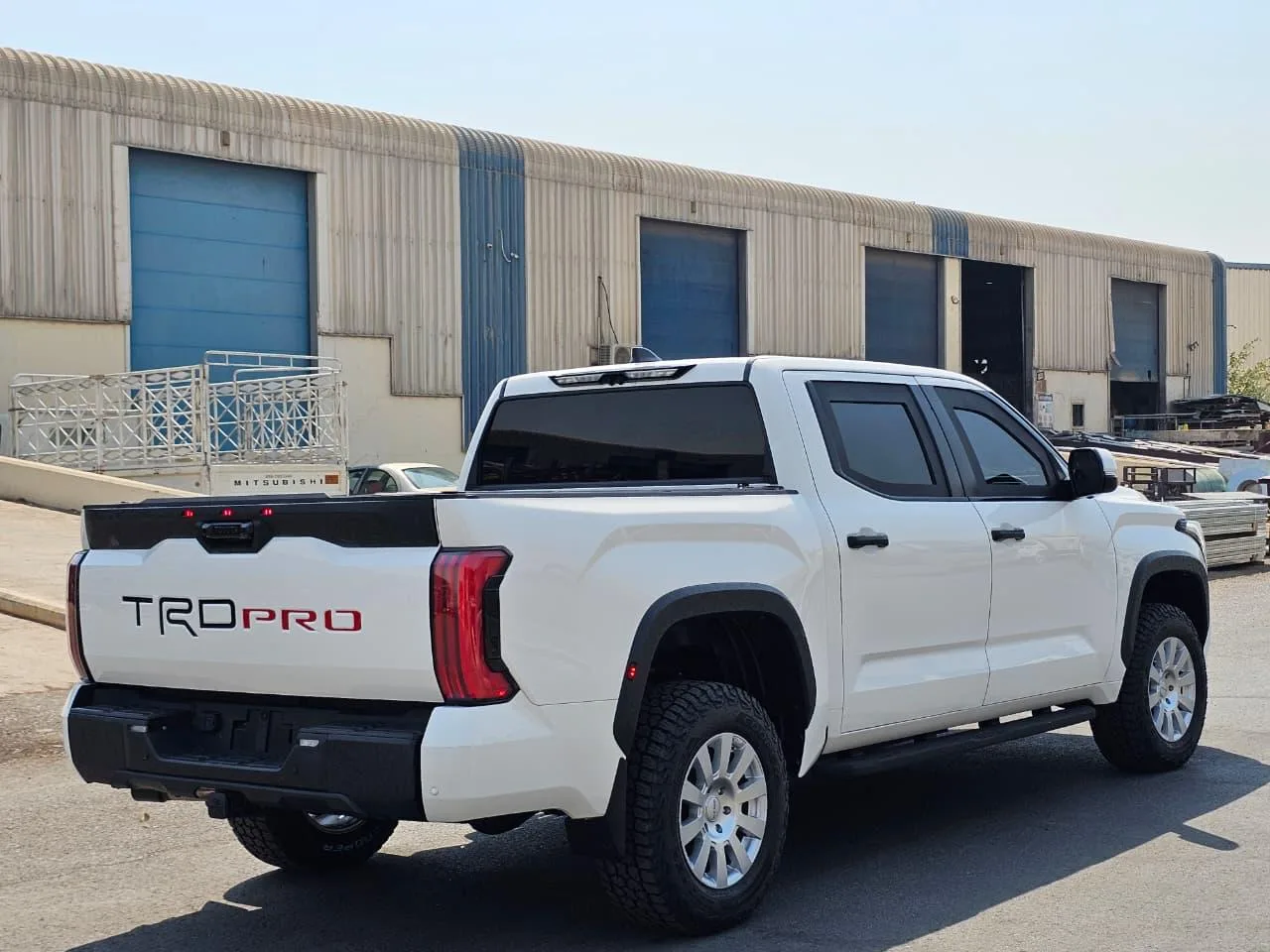 White 2027 Toyota Tundra BR7 armored pickup shown from the rear right side