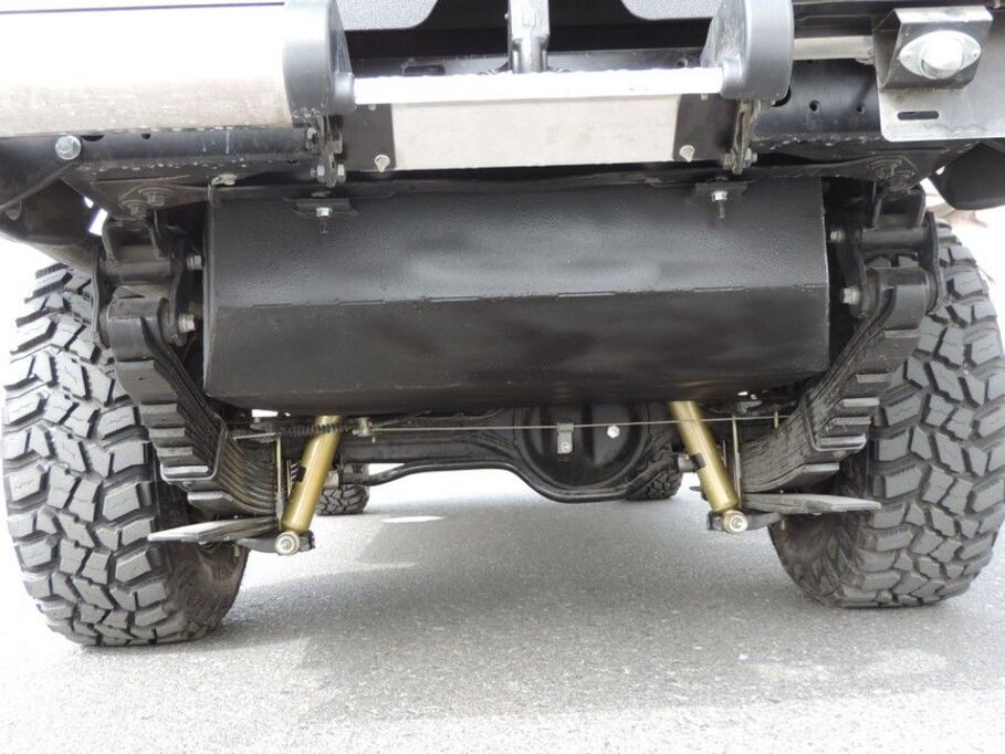 Undercarriage protection and exhaust system on LC79 armored personnel carrier