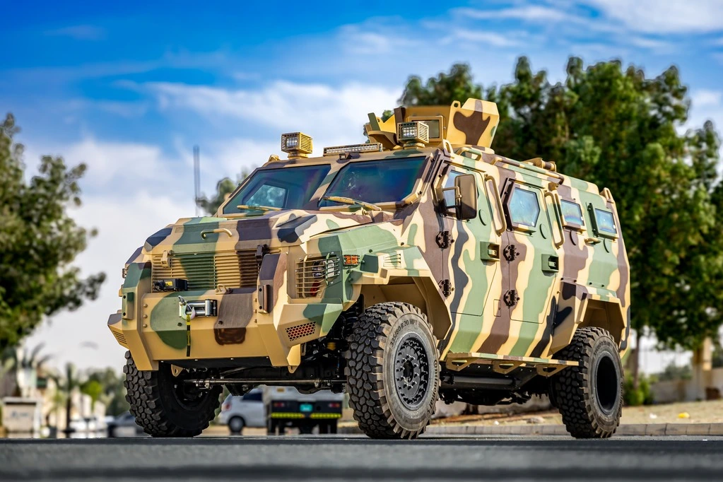 Ford F-550 APC CAMO armored vehicle featuring reinforced chassis and tactical camouflage pattern designed for personnel transport in high-risk environments.