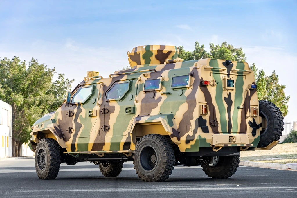 Ford F550 APC Camo rear left view with reinforced chassis and tactical tires