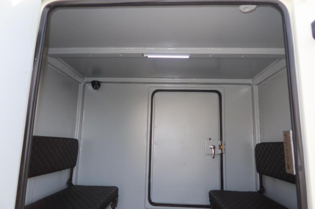 Wide-angle view of LC79 troop compartment with facing bench seats