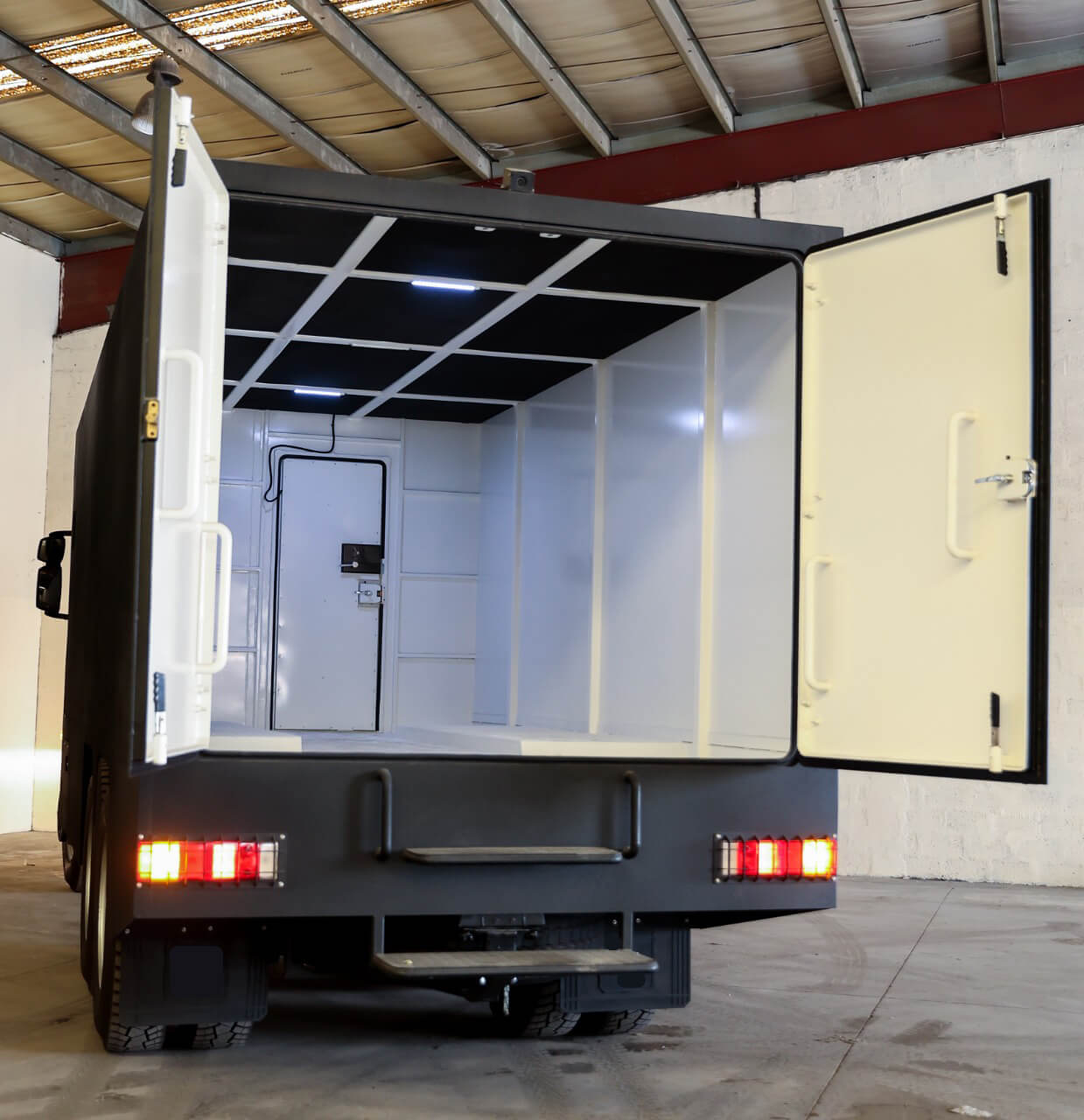 Central Bank CIT rear door open showing protected cargo access